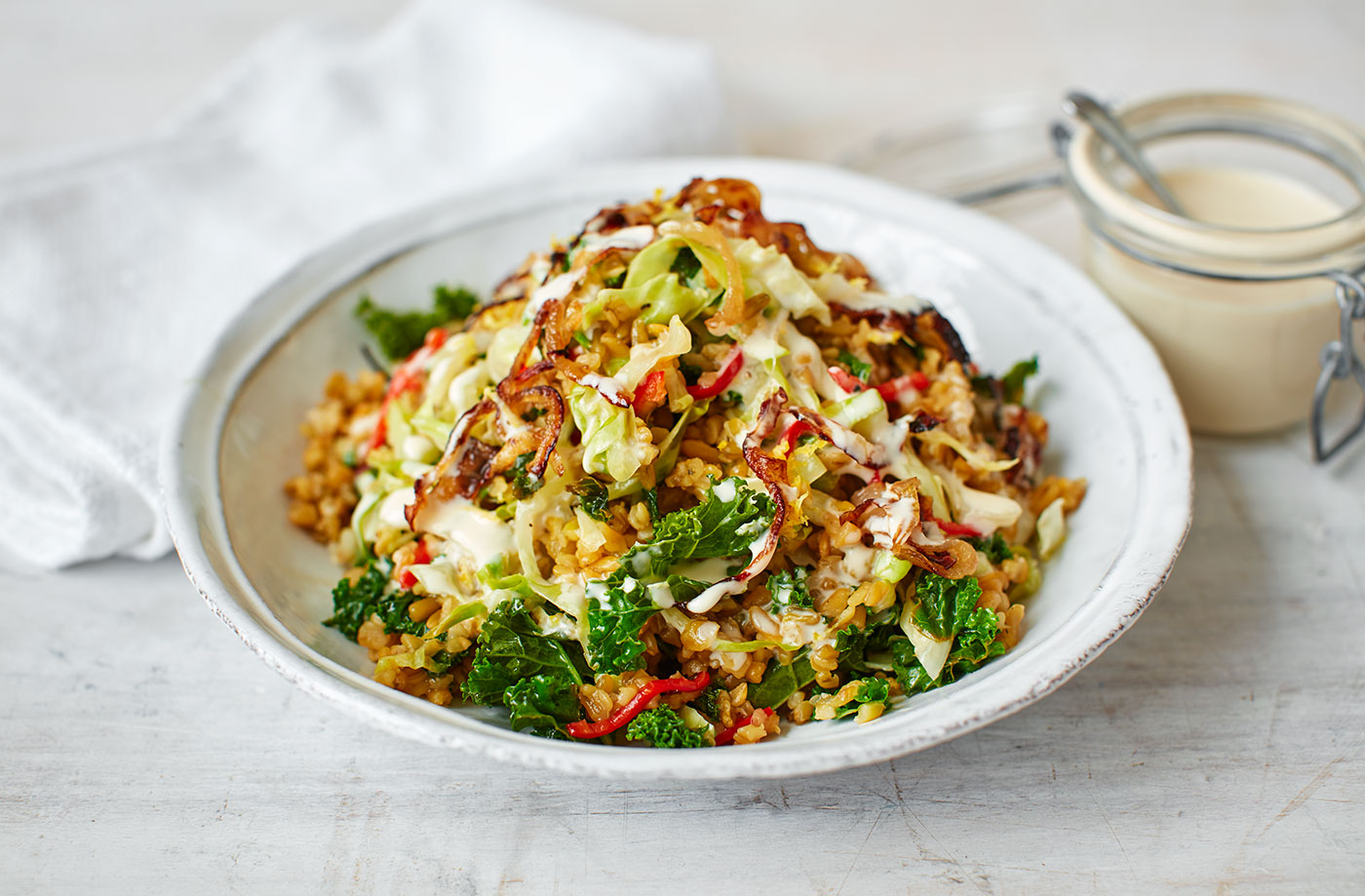 Grains, stir-fried greens and tahini dressing recipe