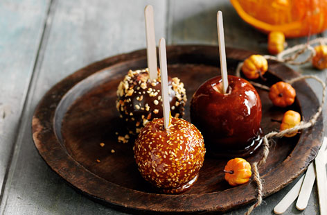 Think toffee apples are just for kids? Think again. These traditional autumnal toffee apples have been given a grown up twist, using hazelnuts and chocolate, and toffee and sesame seeds as the toppings.