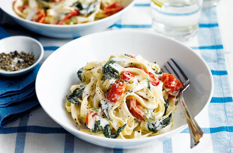 This delicious dinner is ready in minutes and combines juicy tomatoes, spinach, and fiery chilli, with tagliatelle pasta and a creamy sauce