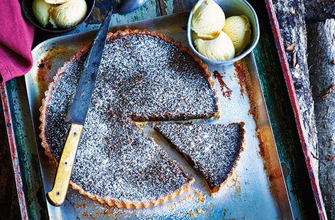 This indulgent treacle tart recipe uses gorgeous golden syrup and black treacle for a rich and sticky pudding. With a beautifully buttery pastry, flavoured with zesty orange, it's a truly delicious dessert that's the perfect Bonfire Night recipe