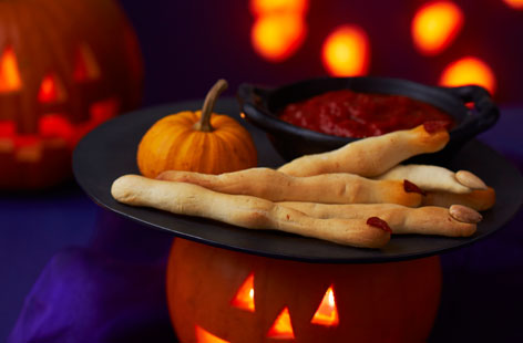 Treat your tricksters with some ghoulishly great cheesy witches' fingers complete with a bloody dipping sauce