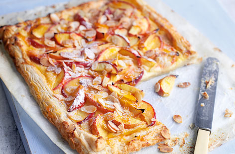 Fruit loves almonds, and in this easy tart juicy nectarines are the perfect foil for toasted flaked almonds, not to mention buttery puff pastry and Devon custard. Ready to roll pastry means an easy assembly job, while the finished dish looks pretty as anything.