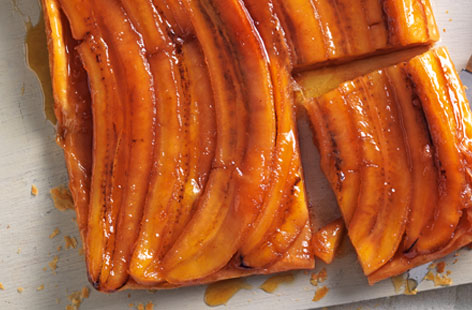 Caramelised bananas and a healthy glug of rum are the secret ingredients in this banana tarte tatin. A 30-minute stint in the oven, until the pastry is puffed and golden, and the caramel sauce is bubbling at the edges, is all it takes to make the tart come to life. Serve with vanilla ice cream.
