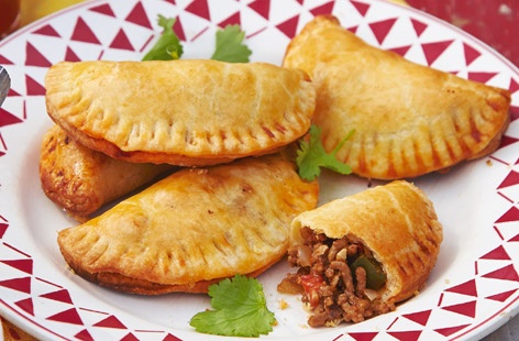 Like cute little pasties, these Spanish empanadas are perfect party finger fodder, filled with a spicy mince sauce with onions and peppers. Serve with a bowl of sour cream or any of your favourite condiments for dipping and dunking.