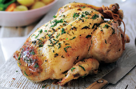 Keep it classic at your next Sunday roast with a juicy roast chicken. This simple recipe has a fragrant onion and garlic stuffing for a crowd pleasing Sunday lunch.
