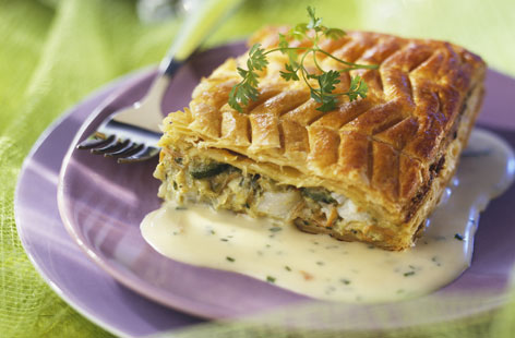 Fish pies often call for mash, but this cod, leek and parsley version comes encased in crispy puff pastry and is paired with a silky chive and crème fraîche sauce. The zig-zag patterned top makes it a great dinner party dish.