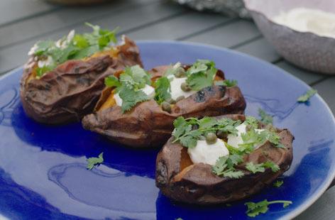 Kids will love the fact that these sweet potatoes are baked in the embers of the barbecue
