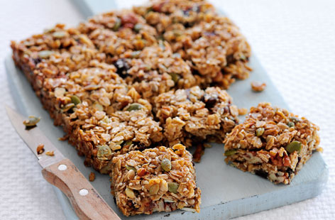 These sweet and sticky flapjack squares are full of flavour and crunch – boasting dates, nuts and three kinds of seeds. They’re easy too, just melt butter with syrup and sugar, then mix with the other ingredients, bake, cool and enjoy!