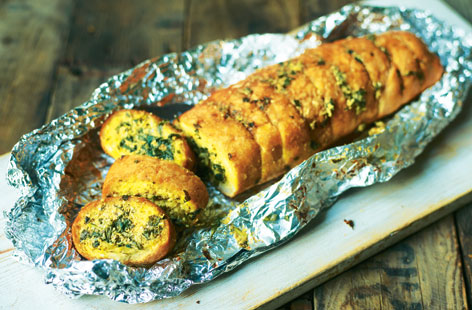 Give your garlic bread a lift by mixing pesto and chopped basil into the garlic butter, then pop it on the barbecue for a winning dish the whole family will love