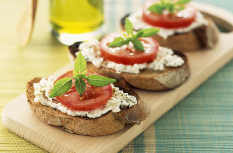 This easy, vegetarian crostini makes a brilliant starter when entertaining friends – or enjoying date night at home. Fresh, summer flavours of tomato, basil and goat's cheese top the wholemeal toasts, for a dish that looks as good as it tastes.