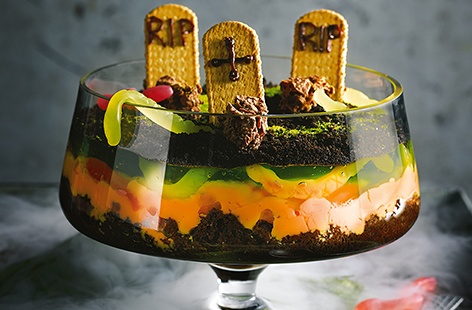 With rich chocolate brownies, vibrant orange custard and creepy green jelly, this spooky twist on a classic trifle is a scarily good Halloween party idea that will definitely impress the kids