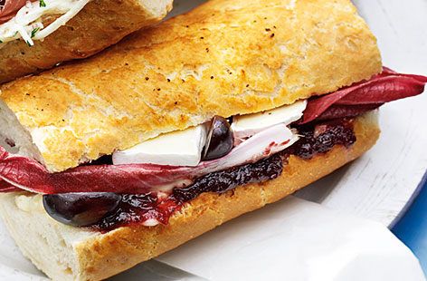 Need some picnic or lunch inspiration? This delicious vegetarian sandwich should do the trick! The sweetness of the grape and cranberry work perfectly with the mild, lightly creamy cheese. As for the bread? It has to be a baguette.