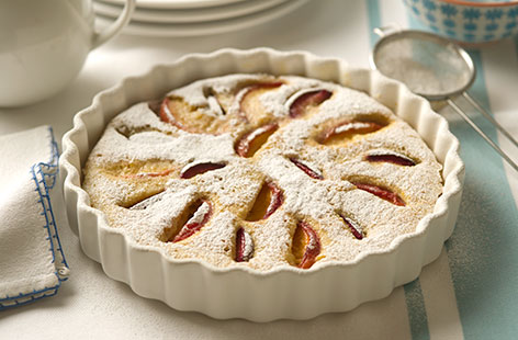 Quartered plums and peaches dot across the top of this thick and flan-like clafoutis. Each slice delivers the ideal balances of sweetness and acidity; the use of soya milk instead of regular milk also means that it's dairy-free.