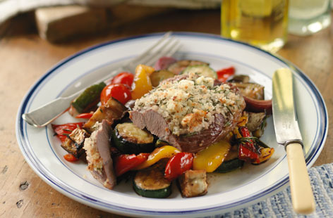 A Mediterranean take on a lamb steak. Ideal if you're looking for something new to add to your reportoire. The mustard and herb crust complements the lamb's favour perfectly, while the bed of roasted peppers, courgettes and aubergines adds a taste of summer.