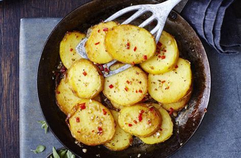The perfect side dish to make for any main meal - creamy miniature potatoes are cooked with fragrant oregano, garlic and chilli and fried until crisp.