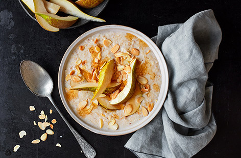 Have a filling, comforting breakfast ready in 10 minutes with this easy pear and almond porridge recipe. The simple combination of fresh juicy pear, crunchy almonds and a drizzle of sweet maple syrup is the perfect start to the day.