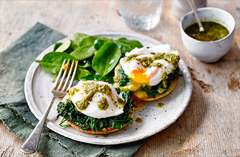 Try a new twist on classic eggs Florentine with this easy brunch recipe using a zesty pesto sauce