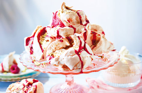 Drizzled in a raspberry coulis and topped with chopped pistachios, this fruity meringue is the perfect summer dessert