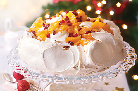 A beautiful dessert to end a Christmas meal with a bang, this Pavlova is adorned with gorgeous clementine pieces and jewel-like pomegranate seeds. And as if that wasn't enough, a gorgeous syrup made with clementine zest, juice, sugar and white wine is stirred into the whipped cream on top.