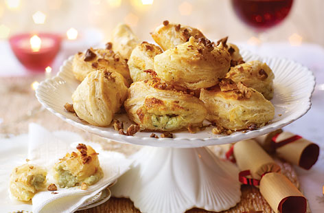 Christmas equals parties with prosecco and hot canapés, and these Stilton and walnut puffs are just the ticket. Simply cut circles into ready-made puff pastry and spoon over Stilton mashed with cream cheese. Fold into half moons, top with walnut pieces and bake until golden.