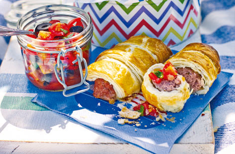 Sausage rolls are a summertime picnic classic for good reason. Here they're given a summery, herby twist. Serve with the homemade salsa, which mixes sweet cherry tomatoes with fresh basil and tangy black olives