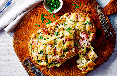 Make your mission against food waste fun with this garlic loaf made up of leftover odds and ends. Load up a sourdough loaf with garlic, mayo, mozzarella and chunks of ham, bake until the mozzarella is perfectly melted, then let everybody dig in!