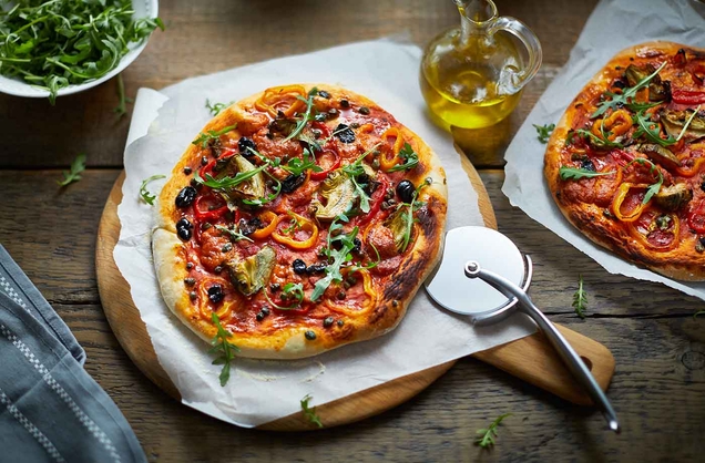 Vegan pizza with peppers, artichokes and olives