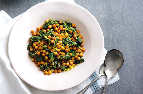 Liven up you spinach salad by adding nutritous chickpeas gorgeously spiced with fiery harissa for an even more satisfying side